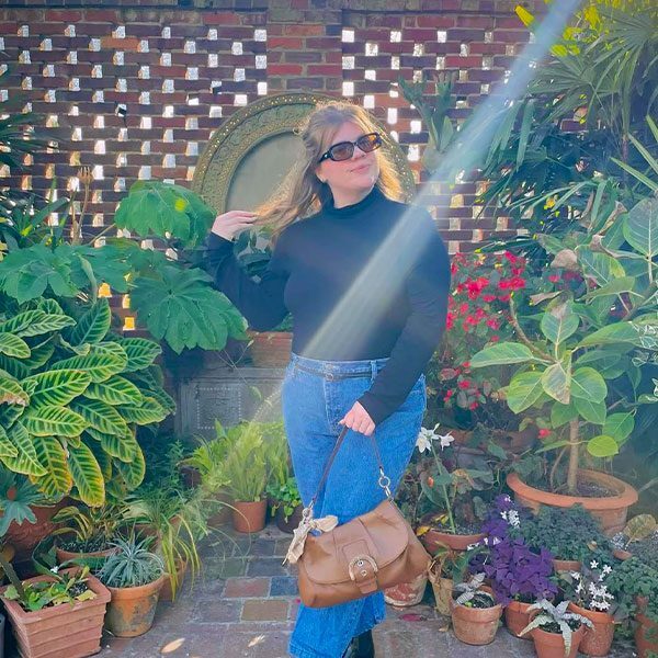 Anslee Patrick with a plants all around her