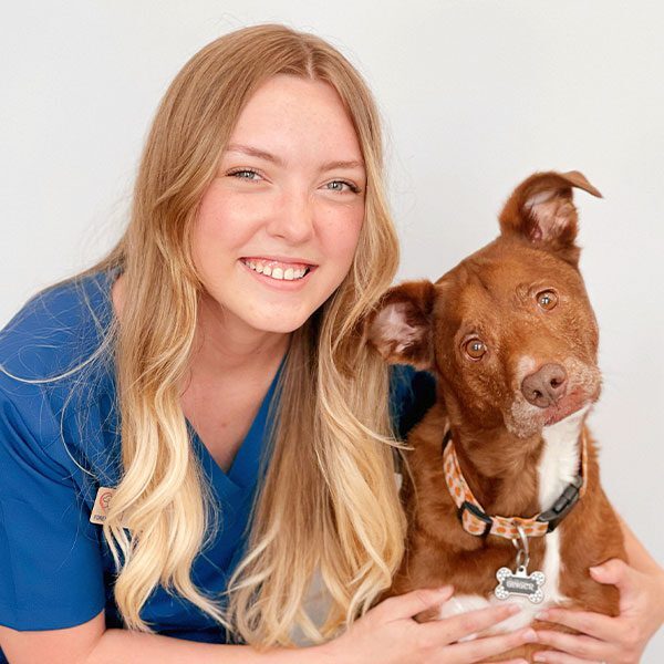 Brandy Lathrop hugging her dog