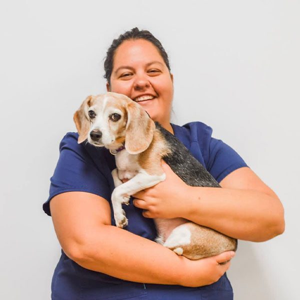 Carrie Songer holding her small dog