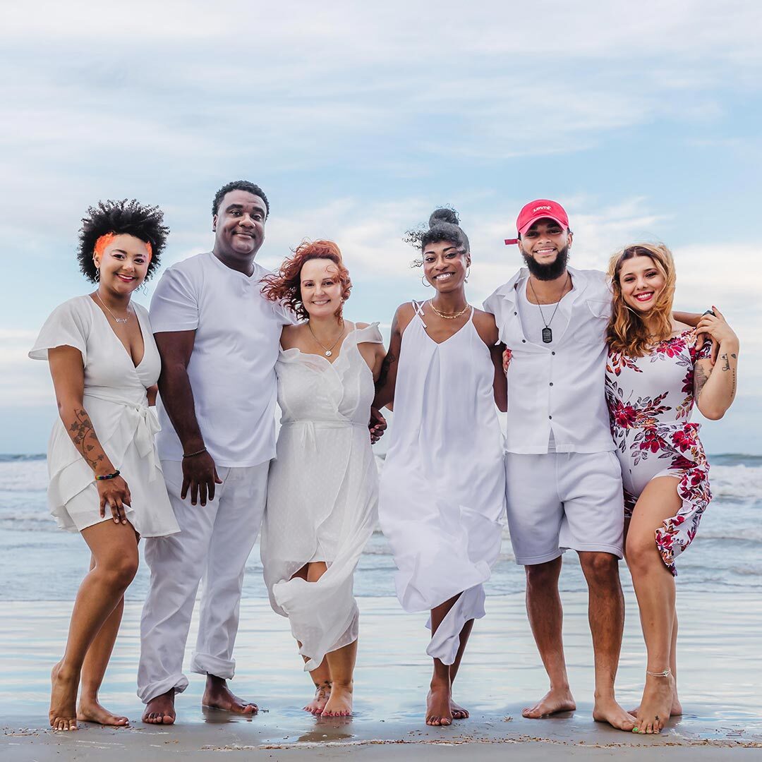 Dr Aerielle Moss with her family on the beach