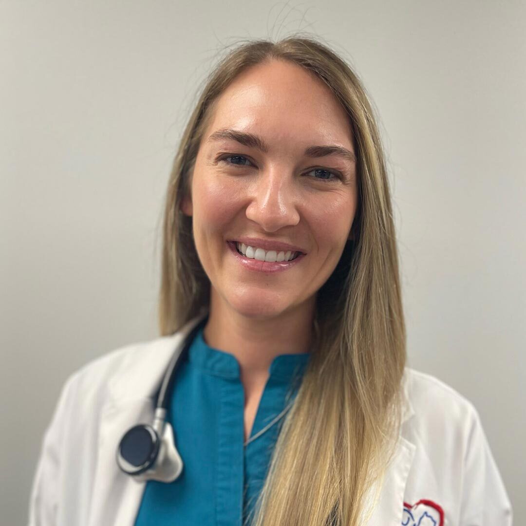 Dr Kayla Briley wearing a blue top and smiling at the camera