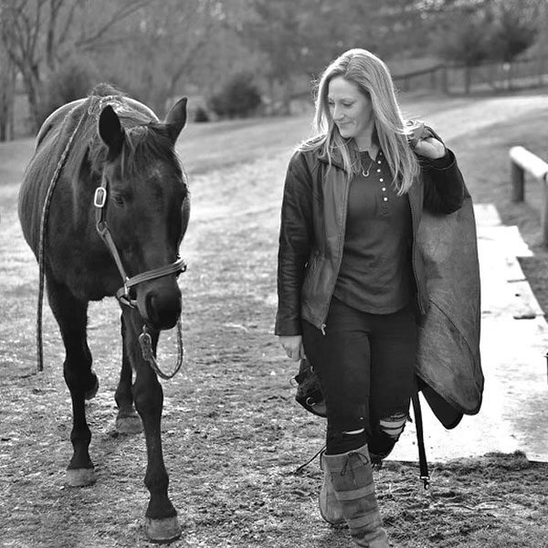 Lara Heil walking with her horse