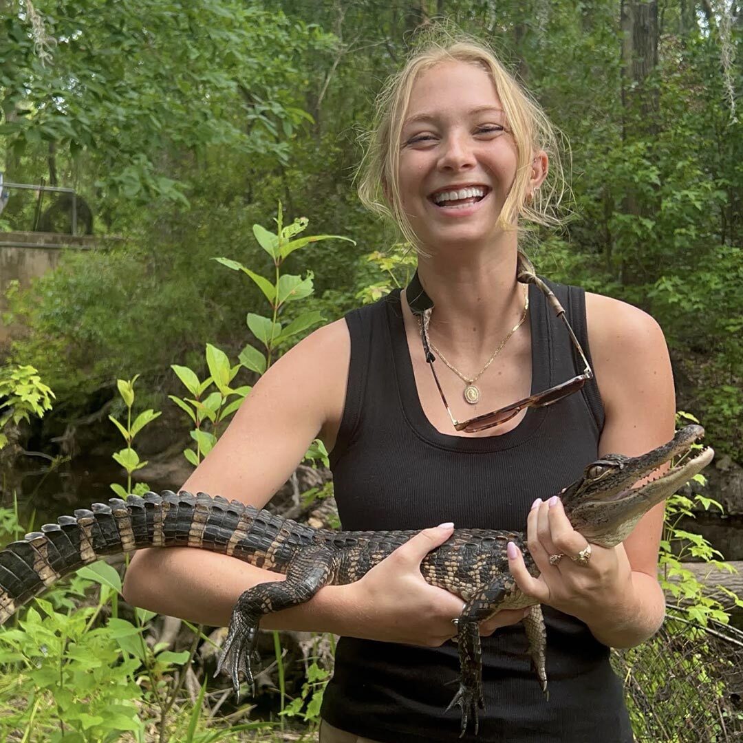 Olivia Mcgehee holding a baby alligator