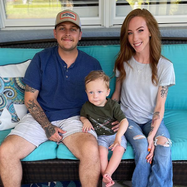 Rae Scott with family on the couch